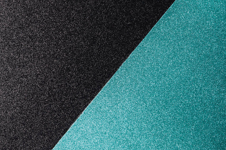 双色几何浅蓝色和黑色闪烁的背景与空间的文本.照片