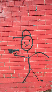 The figure of a drawn man holding a megaphone. 