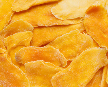 dehydrated mango as a background. dried fruits.