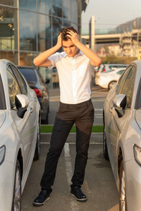 Emotional teenager in car dealership buying first car