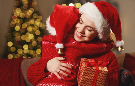 happy family mother and child daughter giving christmas gift 