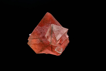 macro mineral stone pink fluorite on a black background 