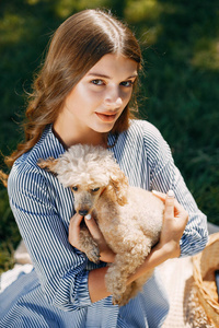 Elegant and stylish girl in a spring park