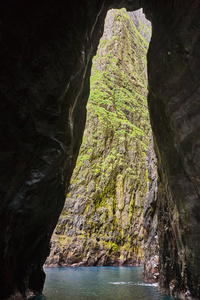 Stunning stone cliffs and caves. Atlantic ocean, Faroe islands. 