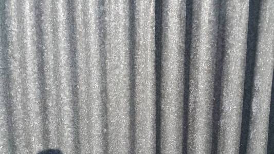 Silver corrugated metal sheet texture background 