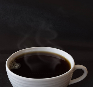 Close up black coffee in white cup 