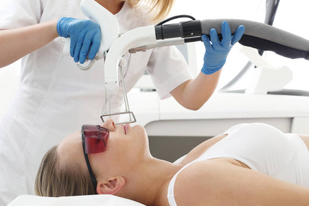 Laser hair removal. Woman in a cosmetic clinic during mustache h