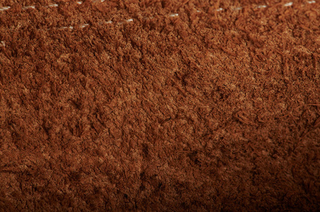 棕色蓬松背景，缝线