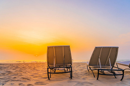 Empty chair on the tropical nature beach and ocean sea at sunris