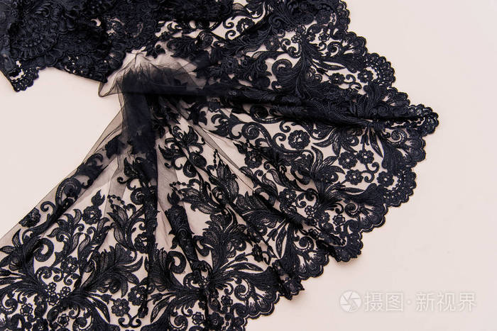 纹理蕾丝面料.白底花边工作室.纱或线制成的薄织物.象牙色蕾丝布的背