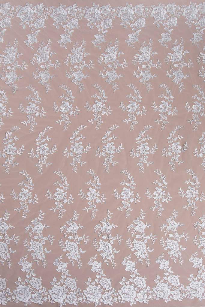 纹理蕾丝面料白底花边工作室纱或线制成的薄织物象牙色蕾丝布的背景