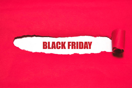 红色撕开的封面，白色的背景，黑色的字样星期五。广告世界销售日。