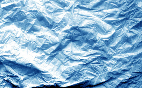 一张皱巴巴的纸，带有海军蓝色调的模糊效果。