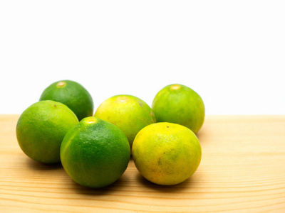 Lime isolated on a wooden floor. 