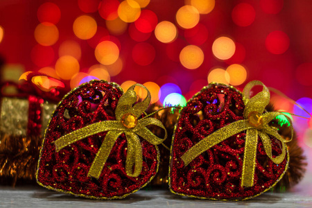 Glittery heart shaped Christmas balls. Christmas decorations on 