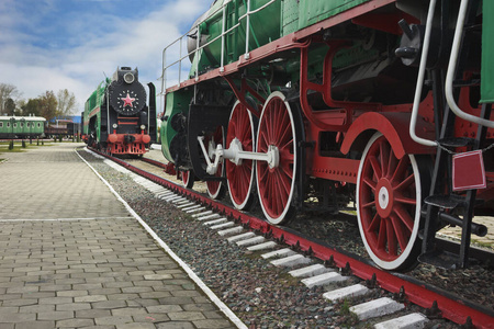 Wheels of a green Sovietmade passenger locomotive. It was made 