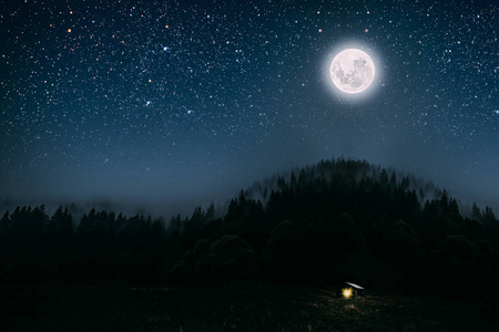 The moon shines over the manger of christmas of Jesus Christ. 