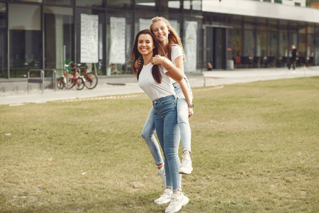 Elegant and stylish girls in a autumn park