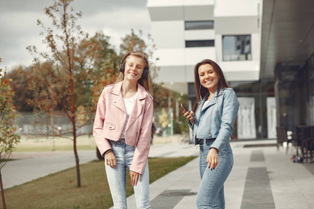 Elegant and stylish girls in a autumn park