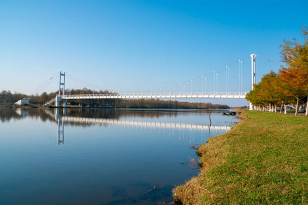 Beautiful view of gold lake and white iron bridge in Maltakva 