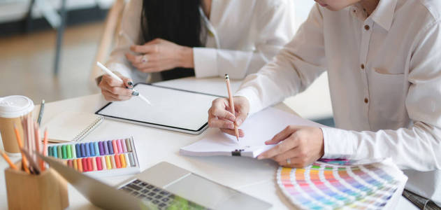 Cropped shot of young professional designer working on their con