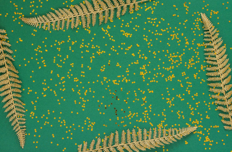节日背景与闪闪发光的金蕨树叶