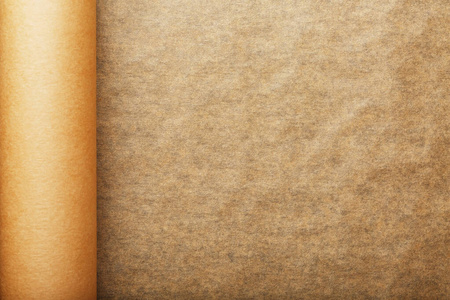 以羊皮纸为背景,展开成卷.照片