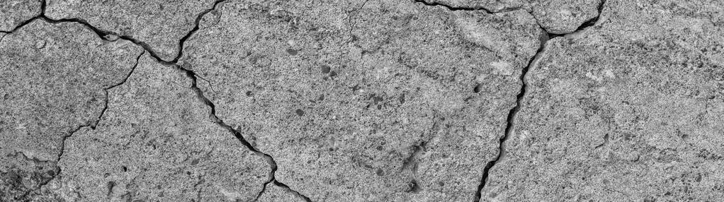 抽象水泥背景。裂缝混凝土纹理特写。