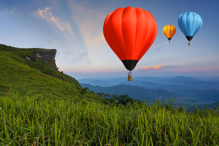 Balloon on twilight sky over high mountains viewpoint at sunset 