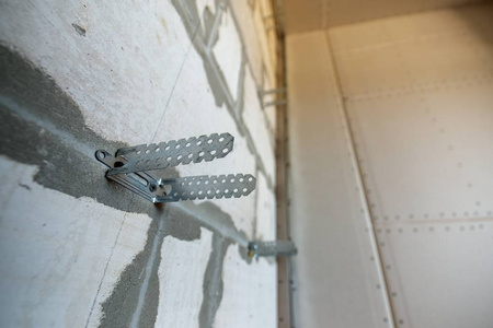 Unfinished brick wall in a room under construction prepared for 