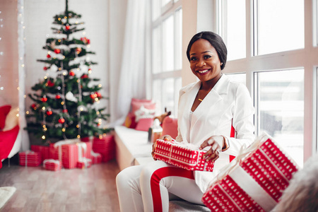 Elegant black girl in the Christmas decorations