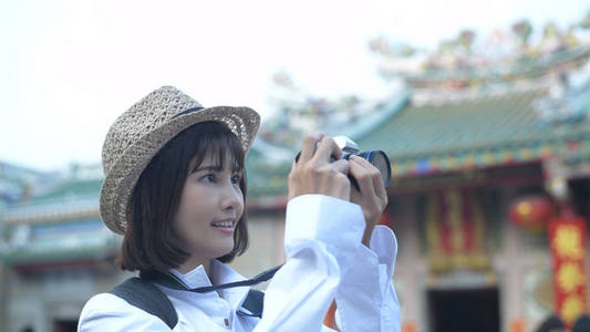 Travel concept. A beautiful girl is enjoying taking pictures in 