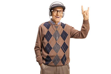 Elderly gentleman with headphones making a rock and roll sign 