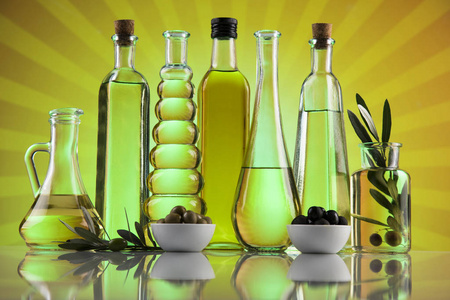 Olive oil bottles, olive branch and Cooking oils 