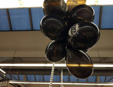 Turin, Piemonte, Italy.November 2019.Black Friday balloons at a 