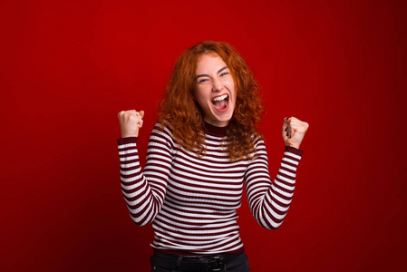 YEEEEE  Crazy ginger girl screaming and celebrating over red 