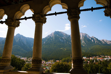 Photo of antique columns on beautiful mountains scape and city, 