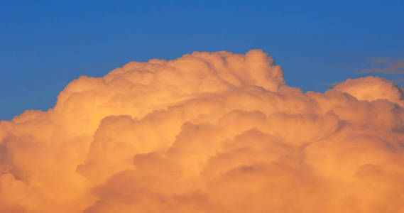 clouds in the blue sky. a visible mass of condensed water vapor 