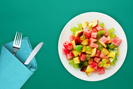  healthy food. fresh fruit salad on a white  plate. vegan food o