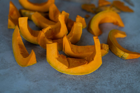 raw, cleaned pumpking slices with seed around it. ready to cook 