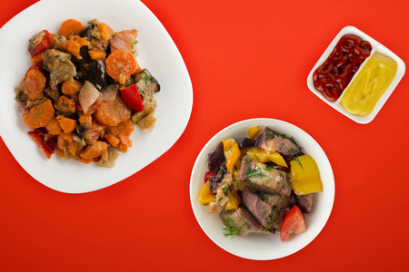 vegetable stew on a white plate. stewed vegetables on a colored 