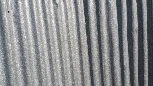 Silver corrugated metal sheet texture background 