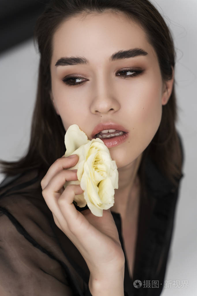 beautifulasiangirlwearingtrousersatransparentblouseand