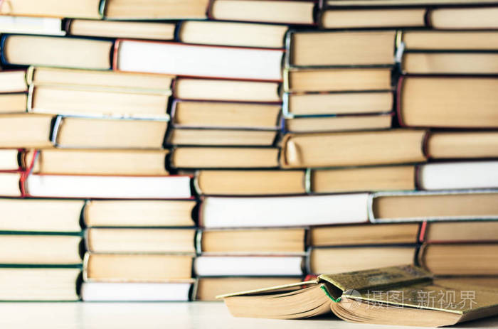 Books background, open book on white wooden table in  for 