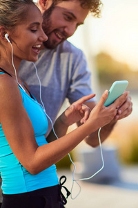 Modern woman and man jogging  exercising in urban surroundings 