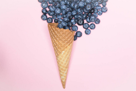 Berry  cream. Blueberry in a horn. On a background for an ins