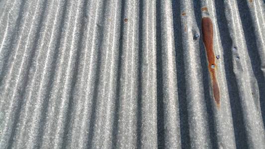 Silver corrugated metal sheet texture background 