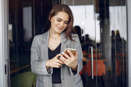 Elegant businesswoman working in a  and use the phone