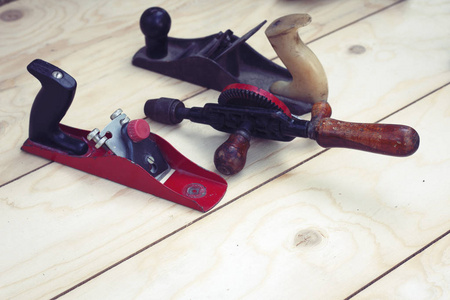 Joinery  old wooden plane, wood polishing tool in a workshop 