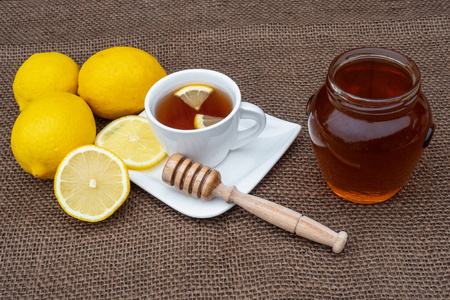 Cup of tea with honey and lemon. 